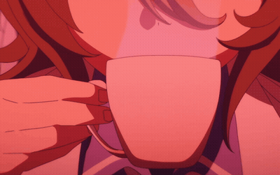 A Close Up Of A Person 'S Face With A Cup In The Foreground GIF