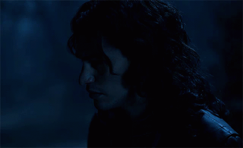 A Close Up Of A Person 'S Face With A Dark Background GIF