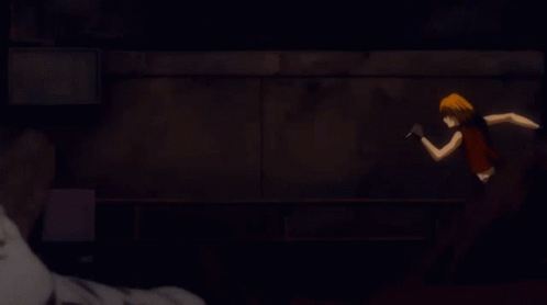 A Close Up Of A Person 'S Face With A Dark Background GIF