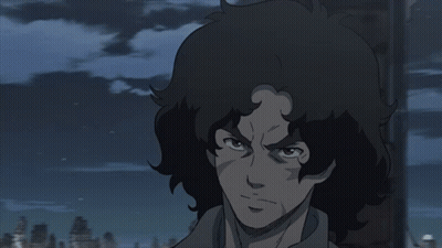 A Close Up Of A Person 'S Face With A Dark Background GIF