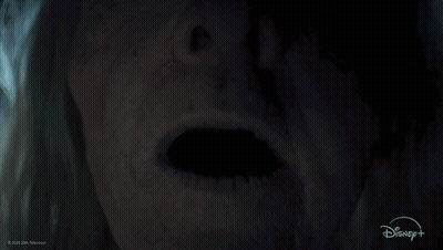 A Close Up Of A Person 'S Face With A Disney Logo GIF