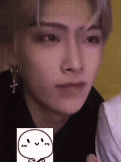 A Close Up Of A Person 'S Face With A Drawing Of A Smiley Face . GIF
