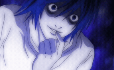 A Close Up Of A Person 'S Face With A Finger In Their Mouth GIF