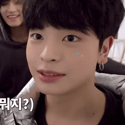 A Close Up Of A Person 'S Face With A Foreign Language Written On The Bottom Right GIF