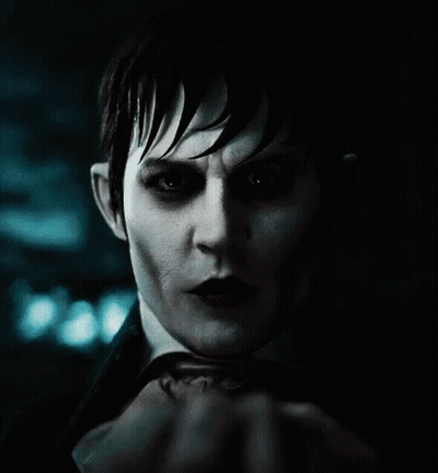 A Close Up Of A Person 'S Face With A Hand Covering It GIF
