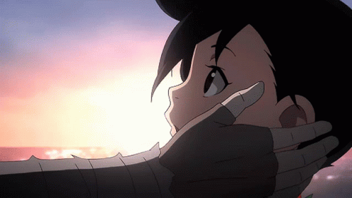 A Close Up Of A Person 'S Face With A Hand Covering Their Mouth GIF
