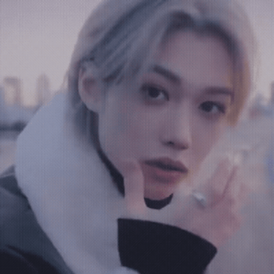 A Close Up Of A Person 'S Face With A Hand On Their Face . GIF