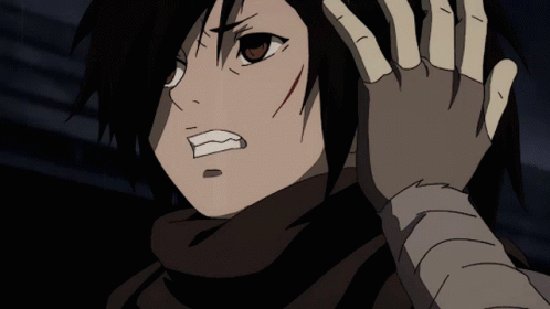 A Close Up Of A Person 'S Face With A Hand On Their Head GIF