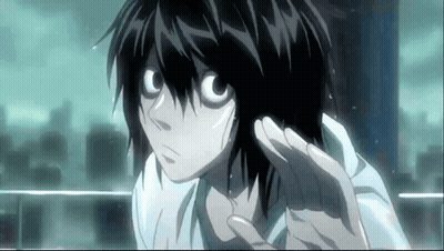 A Close Up Of A Person 'S Face With A Hand Outstretched GIF