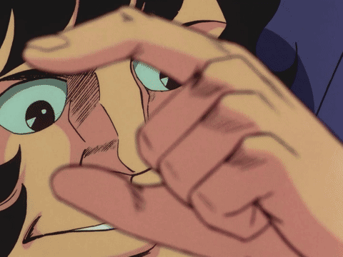 A Close Up Of A Person 'S Face With A Hand Pointing At It GIF