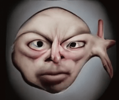 A Close Up Of A Person 'S Face With A Hand Sticking Out GIF