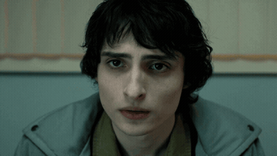 A Close Up Of A Person 'S Face With A Hooded Jacket On GIF