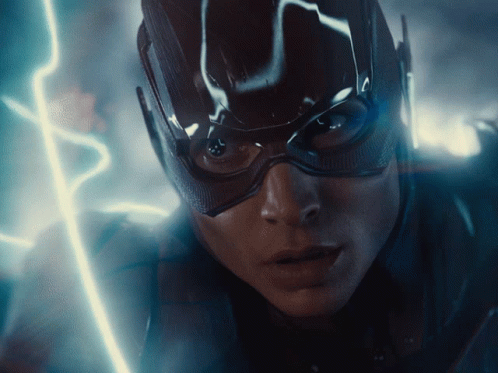 A Close Up Of A Person 'S Face With A Lightning Bolt Behind Them GIF