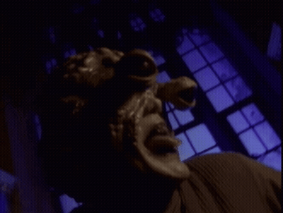 A Close Up Of A Person 'S Face With A Mask On GIF