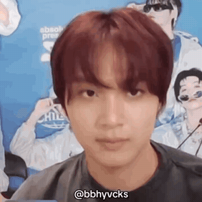 A Close Up Of A Person 'S Face With A Microphone In Front Of Him . GIF
