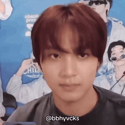 A Close Up Of A Person 'S Face With A Microphone In Front Of Them . GIF