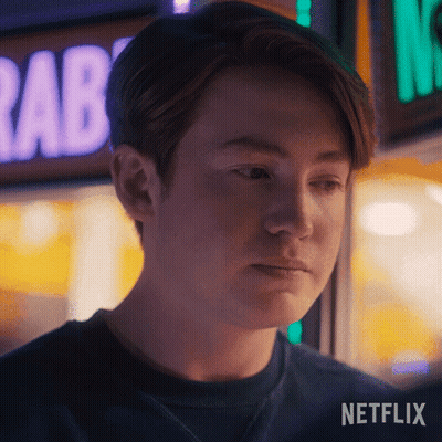 A Close Up Of A Person 'S Face With A Netflix Logo In The Bottom Right Corner GIF