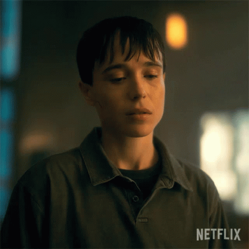 A Close Up Of A Person 'S Face With A Netflix Logo In The Corner . GIF