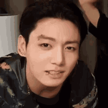 A Close Up Of A Person 'S Face With A Piercing In His Eyebrow . GIF