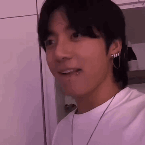 A Close Up Of A Person 'S Face With A Piercing In Their Lip . GIF