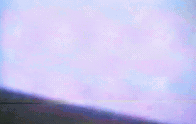 A Close Up Of A Person 'S Face With A Purple Background GIF