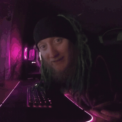 A Close Up Of A Person 'S Face With A Purple Background . GIF