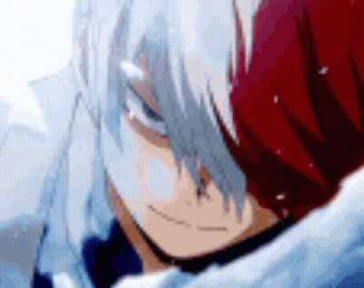 A Close Up Of A Person 'S Face With A Red And White Hair . GIF