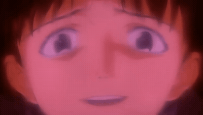 A Close Up Of A Person 'S Face With A Red Background And A Purple Eye . GIF