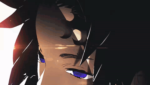 A Close Up Of A Person 'S Face With A Red Light Behind It GIF