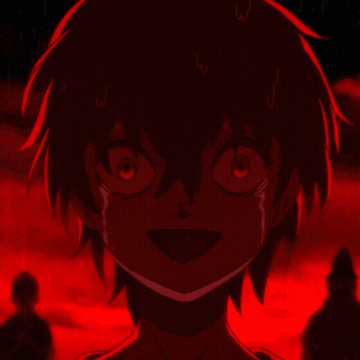 A Close Up Of A Person 'S Face With A Red Light Behind Them GIF