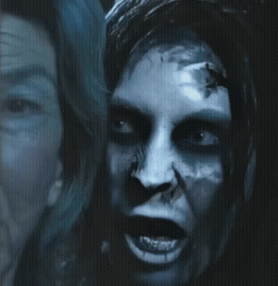 A Close Up Of A Person 'S Face With A Scary Look On Their Face GIF