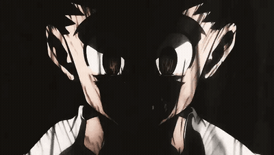 A Close Up Of A Person 'S Face With A Shadow Of A Person Behind Them . GIF