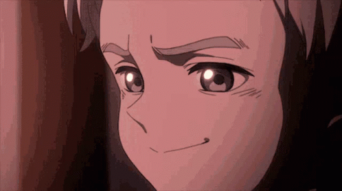 A Close Up Of A Person 'S Face With A Slight Smile On Their Face GIF