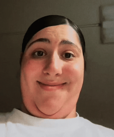 A Close Up Of A Person 'S Face With A Smile On It GIF