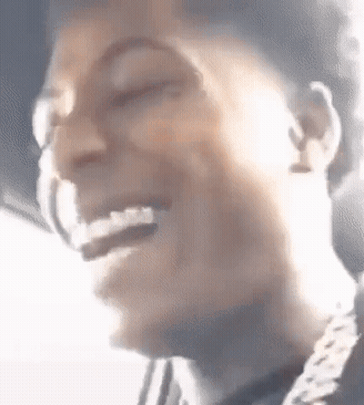 A Close Up Of A Person 'S Face With A Smile On It . GIF