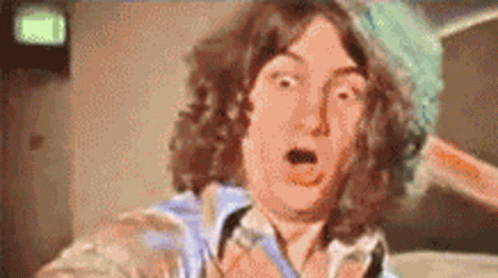 A Close Up Of A Person 'S Face With A Surprised Look On His Face GIF