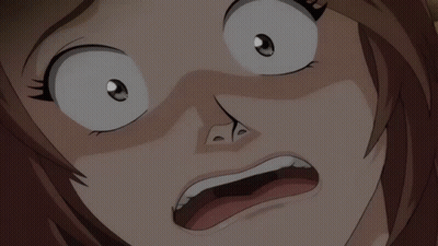 a close up of a person 's face with a surprised look on their face