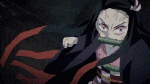 A Close Up Of A Person 'S Face With A Sword In Her Mouth GIF