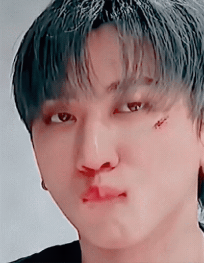 A Close Up Of A Person 'S Face With A Tattoo On Their Face GIF