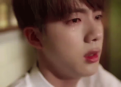 A Close Up Of A Person 'S Face With A Tear Coming Out Of His Eye . GIF
