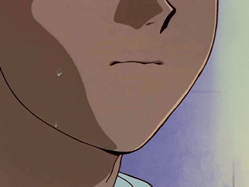 A Close Up Of A Person 'S Face With A Tear Coming Out Of His Mouth GIF