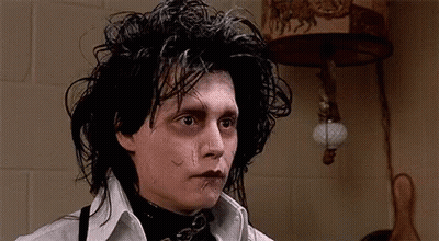 A Close Up Of A Person 'S Face With A Tear In His Eye . GIF