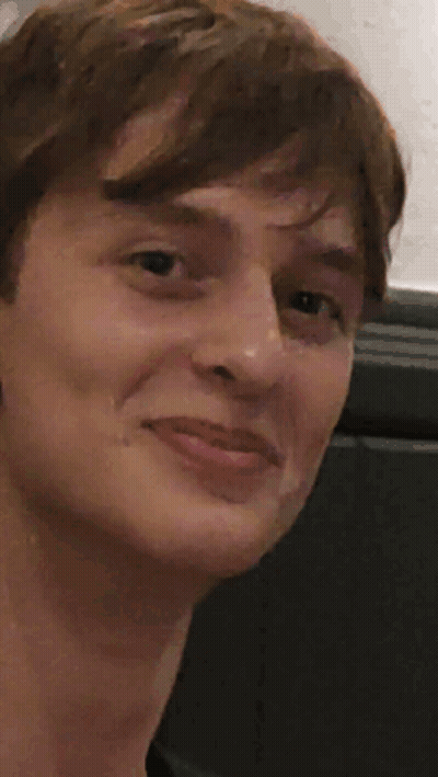A Close Up Of A Person 'S Face With A Thumbs Up GIF
