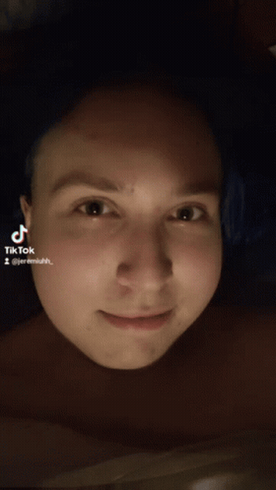 A Close Up Of A Person 'S Face With A Tiktok Sticker On It GIF