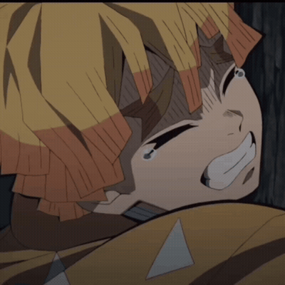 A Close Up Of A Person 'S Face With A Triangle On Their Head GIF