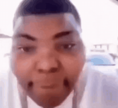 A Close Up Of A Person 'S Face With A Very Funny Face . GIF