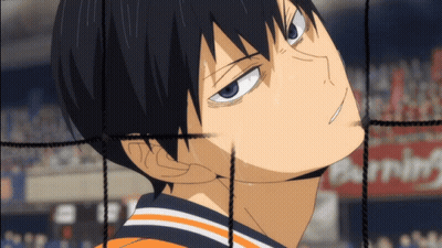 A Close Up Of A Person 'S Face With A Warning Sign Behind Him GIF