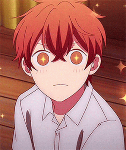 A Close Up Of A Person 'S Face With A White Shirt And Red Hair GIF