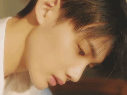 A Close Up Of A Person 'S Face With A White Shirt GIF