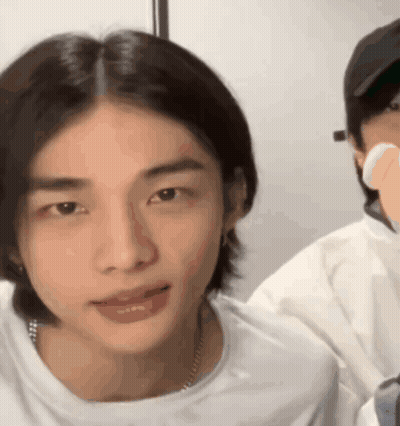 A Close Up Of A Person 'S Face With A White Shirt On GIF